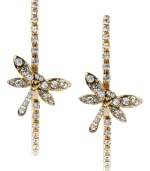 Spread your style wings with these chic hoops from Betsey Johnson. Earrings feature dragonfly charms and round-cut crystal accents. Crafted in gold tone mixed metal. Approximate diameter: 1-3/4 inches.