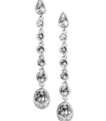 Admirers will line up when you accent your evening wear with luminous linear drops. Givenchy earrings feature round-cut crystals set in silver tone mixed metal. Approximate drop: 1-1/2 inches.