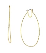 Frame your face in classic hoops with modern appeal. BCBGeneration's oval-shaped hoop earrings are both bold and versatile in a gold tone mixed metal setting. Approximate diameter: 3 inches.