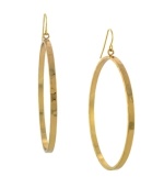 Stir up some drama in eye-catching hoops. BCBGeneration takes style to the next level in large drop hoops crafted in gold tone mixed metal. Approximate diameter: 2-1/2 inches.