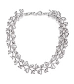 Elaborate elegance. An interlaced motif with an airy, linear aesthetic defines Swarovski's Lightness crystal collar necklace. Crafted in silver tone mixed metal, it's adorned with shimmering crystals. Approximate length: 13 inches + 2-inch extender.