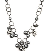 Luxe links. AK Anne Klein's chain link necklace makes a striking statement. With lustrous acrylic pearls in a gorgeous shade of gray as well as glittering glass accents, it's crafted in hematite tone mixed metal. Approximate length: 16 inches.