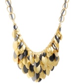 Cascading leaves in two-tone metallics look good whatever the season! Kenneth Cole New York's shimmery cluster necklace features leaf-shaped charms in gold and hematite-plated mixed metal. Approximate length: 17 inches +3-inch extender. Approximate drop: 2 inches.