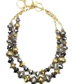 Versatility at its finest. Jones New York's trendy two-tone necklace combines two, graduated rows of silver and gold tone plastic and mixed metal beading with a toggle clasp closure. Approximate length: 17 inches + 3-inch extender.