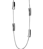 Polish your look with chic, contemporary accessories. Nine West's unique style transitions effortlessly from day to night. Set in silver tone mixed metal with long station beads. Approximate length: 36 inches.