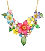 Come up for fresh air. Infuse your look with spring in Betsey Johnson's statement necklace. Clusters of enamel flowers, leaves, and ladybugs adorn this not-so-subtle style. Crafted in gold-plated mixed metal with sparkling crystal accents. Approximate length: 15 inches + 3-inch extender. Approximate drop: 2-3/4 inches.