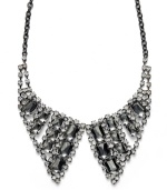 Bar III's extravagant collar necklace resembles, literally, a collar! Turn any look into a black tie-ready ensemble with the crystal details and unique hematite-plated mixed metal setting of this unusually-chic necklace. Approximate length: 20 inches + 3-inch extender. Approximate drop width: 4-1/4 inches. Approximate drop length: 4 inches.