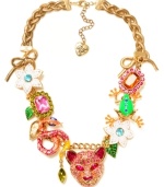 Turn on the charm with this funky frontal necklace from Betsey Johnson. Fabulously flaunts gold tone bows, tiger accented with pink-colored crystals, green frog with blue-colored crystals, pink and orange rectangular gems with crystal accents, green and gold tone leaves, snake with crystal accents and white flowers with crystal accents. Crafted in gold-plated mixed metal. Approximate length: 18 inches + 3-inch extender. Approximate drop: 1-3/4 inches.