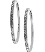 Go big this season. T Tahari blends silver tones with shimmering crystal studs on these large hoop earrings. Crafted in silver tone mixed metal. Base metal is nickel-free for sensitive skin. Approximate diameter: 1-1/4 inch.