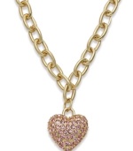 Accessorize to your heart's desire. Charter Club's adorable heart pendant features pretty pink crystals in gold tone mixed metal. Approximate length: 16-1/2 inches + 3-inch extender. Approximate drop: 1 inch. Item comes packaged in a signature box.