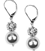 Grace through reflection: Crystal pave balls and glass pearls dangle from these gorgeous drop earrings set in imitation rhodium-plated mixed metal. Approximate drop: 1 inches.