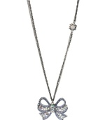 Take a bow. Betsey Johnson's silver tone mixed metal necklace features a sparkling bow pendant accented with clear and blue crystals, while a glass opal gem with crystal accents adorns the double silver tone chain. Approximate length: 32 inches + 3-inch extender. Approximate drop length: 1-3/4 inches. Approximate drop width: 2 inches.