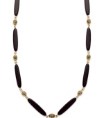 Add instant appeal to any outfit with this chic necklace from Lauren by Ralph Lauren. Featuring glass and resin onyx beads and an easy lobster claw clasp. Textured antique 14k gold plated beads provide the perfect finishing touches. Approximate length: 36 inches.