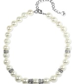 It's all about presentation, and this Givenchy necklace will turn heads. Crafted in silver tone mixed metal, necklace features a sweet strand of polished glass pearls (10 mm and 18 mm) accented by sparkling crystals. Approximate length: 16 inches.