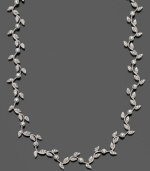 Add a touch of lush nature to your ensemble with this trailing vine necklace. In rhodium-plated mixed metal with crystal accents, by Eliot Danori. Measures approximately 16 inches with a 2-inch extender.