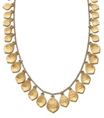 Adorn your neckline with cascading shimmery leaves. This autumn-inspired necklace from the Lauren by Ralph Lauren collection features a plethora of dangling leaf charms of varying size and texture. Crafted in gold tone mixed metal. Approximate length: 18 inches. Approximate drop: 1-1/2 inches.