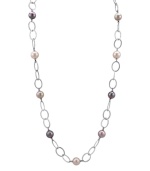 Follow the must-have trend of the season by adding long, elegant layers. Majorica necklace features multicolored, organic, man-made pearls strung on a sterling silver link chain with toggle clasp. Approximate length: 36 inches.