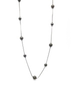 Alfani's long station necklace is sure to be a diverse, dramatic look within your jewelry collection. Crafted in hematite tone mixed metal. Approximate length: 42 inches.