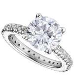 Engagement-style sparkle makes quite the statement. CRISLU's stunning solitaire ring combines a single round-cut cubic zirconia with cubic zirconia side accents (total 3-3/4 ct. t.w.). Crafted in platinum over sterling silver. Size 5, 6, 7, 8 and 9.