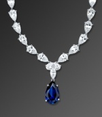 Layer your neckline with elegant design and eye-popping color. This glittering necklace by CRISLU features multiple clear cubic zirconias (50-1/2 ct. t.w.) accented by a bold sapphire-colored cubic zirconia teardrop. Necklace crafted in platinum over sterling silver. Approximate length: 16 inches. Approximate drop: 1 inch.