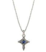 Symbolic style with a hint of color. Vatican pendant features an intricate cross decorated with round-cut clear crystals and a square-cut blue crystal center. Setting and chain crafted in silver tone mixed metal. Approximate length: 16 inches + 3-inch extender. Approximate drop: 1-1/4 inches.