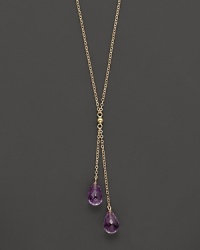 Twin amethyst briolettes sparkle from this 14K yellow gold lariat necklace.