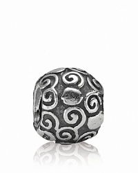 Detailed swirls and dots in sterling silver adorn this beautiful PANDORA charm.