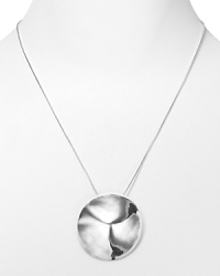 A bold, geometric pendant in plated metal romances this Robert Lee Morris Soho necklace paired with a long, gleaming snake chain.