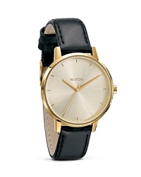 Dial into tomboy chic with Nixon's stainless steel day watch. A classic design with a cool side, this piece is at its best with a pair of oxfords and a boy-borrowed blazer.