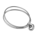 Symbolic of everlasting love and timeless style, Breil's polished bangles feature an overlapping knot design while adding a stylish layered effect. Crafted in stainless steel. Approximate diameter: 2-1/5 inches.