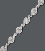 Have her unwrap the perfect gift this season. This stunning tennis bracelet by Wrapped in Love™ features three sleek rows of round-cut diamonds (1 ct. t.w.) set in 14k white gold. Approximate length: 7-1/4 inches.