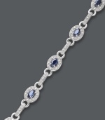 Royal sophistication. This oval link bracelet shines with the addition of oval-cut sapphires (2-5/8 ct. t.w.) and round-cut diamonds (1/4 ct. t.w.). Set in sterling silver. Approximate length: 7-1/2 inches.