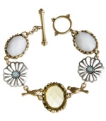 Chirp, twitter or tweet it loud and clear...bird is the word! Lucky Brand's vintage-inspired bracelet style combines intricate cut-out flowers, bezel set stones, and petite bird charms all-in-one. Crafted in silver and gold tone mixed metal with plastic and glass beads and a trendy toggle clasp. Approximate length: 7-3/4 inches.