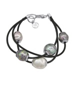 When modest tradition and modern edge combine. This chic, new style by Majorica features three rows of black leather cord strung with multicolored, organic, man-made pearls (12 mm). Setting and clasp crafted in sterling silver. Approximate length: 7-1/2 inches.