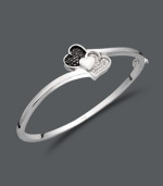 This Treasured Hearts design puts a modern twist on the iconic heart symbol. This stylish bangle features three overlapping hearts and shines with the addition of round-cut black diamonds (1/6 ct. t.w.) and white diamonds (1/3 ct. t.w.). Crafted in sterling silver. Approximate diameter: 2-1/2 inches.