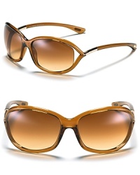 Tom Ford Jennifer sunglasses. Plastic frame sunglasses with logo on lens edge. Open lens detail at temple. Gradient lenses. Case included.