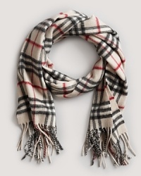 Bundle up in style with Burberry's oblong cashmere scarf in signature giant check print.