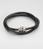 Silver skull accent joins together a double strand of smooth, genuine leather.LeatherSterling silverAbout 2½ diam.Made in the United Kingdom