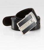 Logo engraved, palladium-plated buckle, accents this reversible leather design.LeatherAbout 1¼ wideMade in Italy