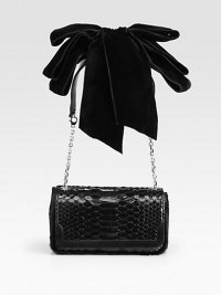 A sleek evening bag that exudes timeless elegance, crafted from rich python and haircalf with a lush velvet bow at the shoulder.Shoulder strap, 10½ drop Magnetic snap flap closure One inside open pocket Faille lining 8W X 4½H X 2D Made in Italy