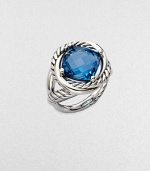 From the Infinity Collection. A richly colored, faceted blue topaz in a setting formed of intertwining smooth bands and cables of sterling silver.Blue topazSterling silverDiameter, about ½Imported