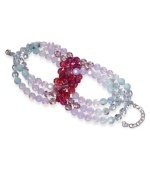 Pale pastels freshen up any ensemble. This sparkling beaded bracelet by Swarovski features mint and fuchsia crystal beads in an overlapping loop design. Crafted in silver tone mixed metal. Approximate length: 7 inches.