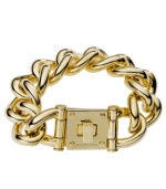 Put this designer style under lock and key. Flaunt bold, flashy links with an intricate lock clasp in this totally-glam bracelet by Michael Kors. Crafted in gold tone mixed metal. Approximate length: 8 inches.