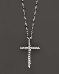 An elegant diamond cross in 18K. white gold. By Roberto Coin.