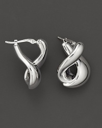 With a languid twist, a foldover hoop earring in polished 14 Kt. white gold.