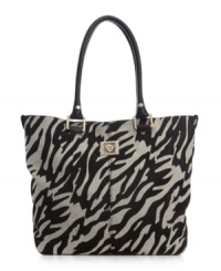 AK Anne Klein goes wild with a zebra stripe to dress up the basic tote purse this season.