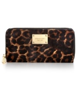 Opt for an exotic vibe with this posh, leopard print design from MICHAEL Michael Kors. Soft haircalf is accented with luxe leather and golden hardware, while the pocket-lined interior holds cash, cards, coins and ID.