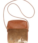 Take on the season's top trend with this haircalf design from Patricia Nash. Rich tan leather, hand-crafted stitching and antiqued brass hardware lend a luxe southwest appeal, while the convenient crossbody strap offers effortless versatility.