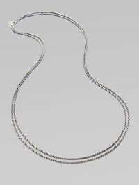 From the Chain collection. Elegant yet sturdy, this double strand of sterling silver features a 14k yellow gold logo at the clasp.Sterling silver 14k yellow gold Length, about 18 when doubled Lobster clasp Imported