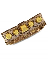 Put a bow on it. This Jessica Simpson bracelet features a gold tone studded bow with glitter detail. Crafted in gold tone mixed metal. Approximate length: 8 inches.